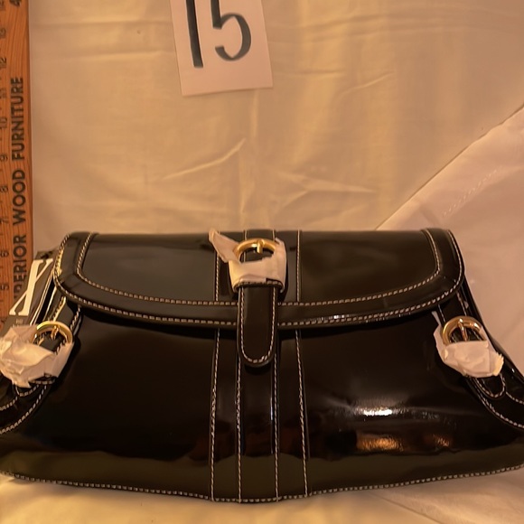 Black brand new MAXX NEW YORK purse. Never used no rips, tears or damage. 14 x 7 - Picture 7 of 11